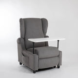 Lift-Relaxsessel Chanel von egoista in Grau mit hoher Rückenlehne, gepolsterten Armlehnen und einem weißen, abnehmbaren Tisch – ideal als komfortabler Pflegesessel für Senioren oder Personen mit eingeschränkter Mobilität